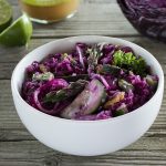 White bowl with a blend of veggies on a wooden table