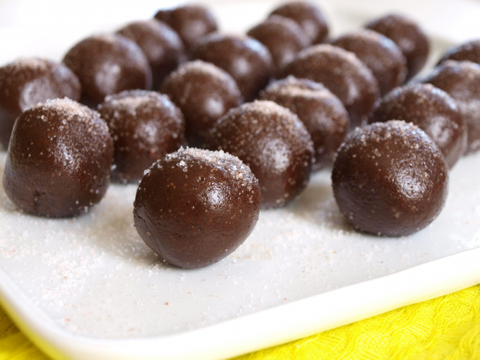 Rolled Chocolate brownies in rows on a plate with salt sprinkled on top