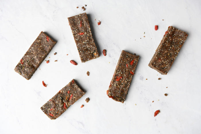 Five rectangular bars with dried gogi berries sprinkled around