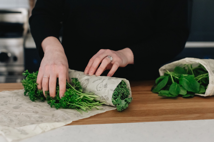 Kale and parsley being rolled in abeego wraps