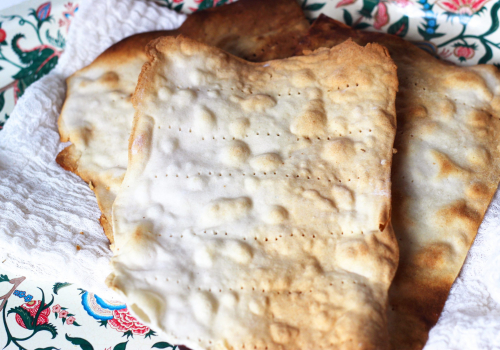 Paleo Grain-Free Matzo (from Predominantly Paleo) on cotton cheesecloth on a placemat