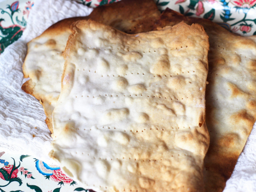 Paleo Grain-Free Matzo (from Predominantly Paleo) on cotton cheesecloth on a placemat