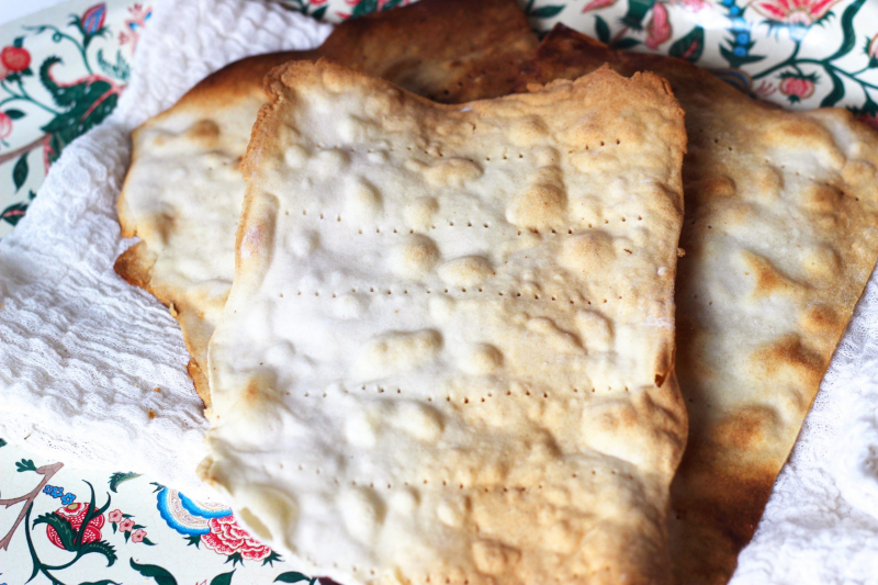 Paleo Grain-Free Matzo (from Predominantly Paleo) on cotton cheesecloth on a placemat