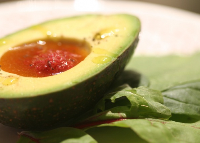 Avocado half with Zeal Dressing on top